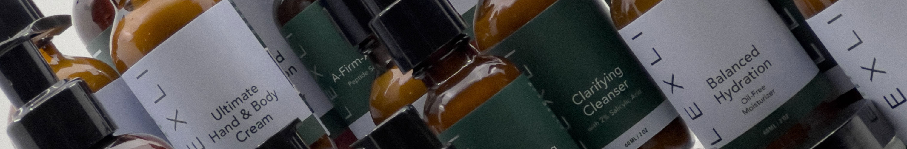 close up of Lexli skin care bottles
