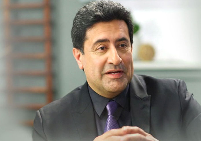 Dr. Abdullah, Lexli Founder, in a dark colored suit